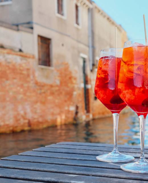 Two,Glasses,Of,Spritz,Veneziano,Cocktail,Served,Near,The,Venetian